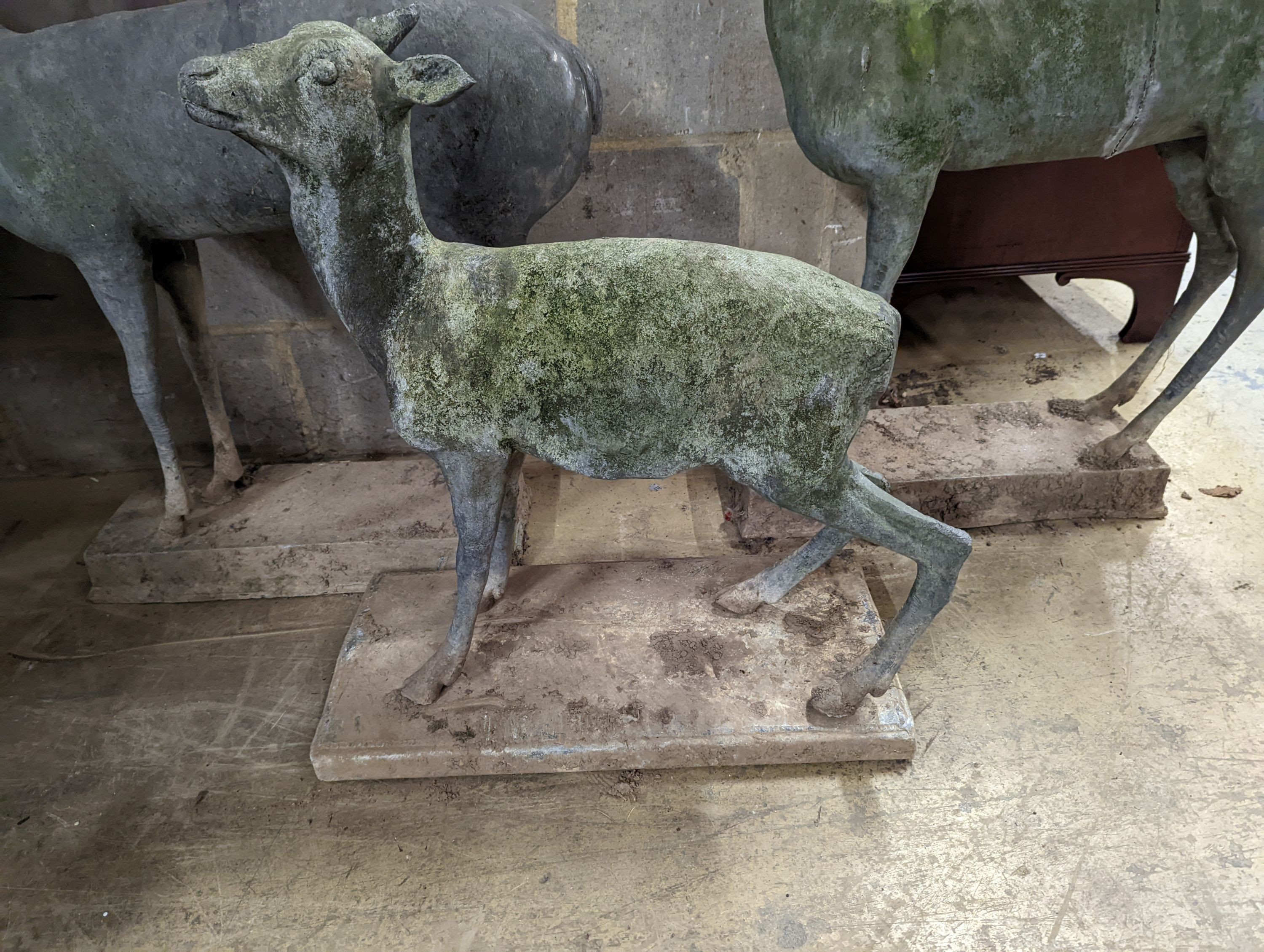 Three lead garden statues modelled as deer, largest height 105cm